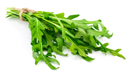 green fresh rucola leaves isolated on white background. Rocket salad or arugula