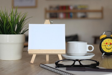 Blank canvas on wooden table