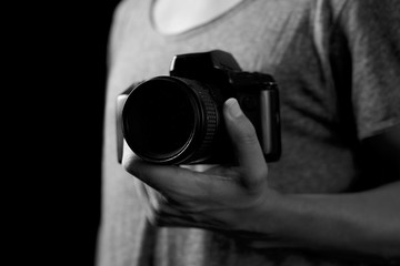 young man with a reflex camera