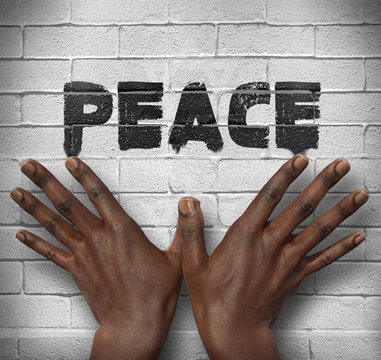 African hands on the wall with text Peace