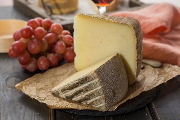Tasting of ancient french demi soft cheese Tomme from French Alps, made from cow, goat or sheep skim milk, low fat french cheese