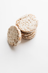 Crisp bread slices isolated over white background, healthy breakfast