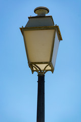 Fototapeta na wymiar French style old vintage street light in small village in Provence, France