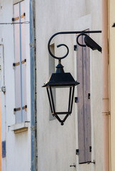 French style old vintage street light in small village in Provence, France