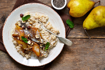 Morning breakfast. Oatmeal, caramelized pear and fried hazelnuts.