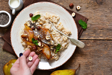 Morning breakfast. Oatmeal, caramelized pear and fried hazelnuts.