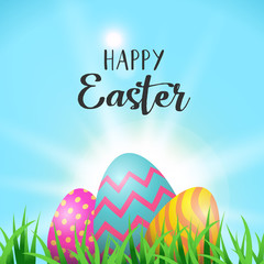 Easter eggs greeting card in spring garden grass