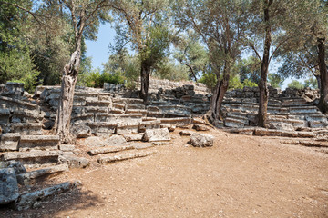 Fototapeta na wymiar Ruins of the antique greek theater, Kedrai, Sedir island,Gulf of Gokova, Aegean Sea, Turkey