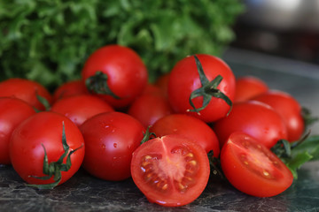 Fresh bright and juicy tomatoes on the kitchen