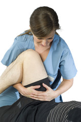 Physiotherapist doing a legs stretching of man patient. Osteopathy over white background.