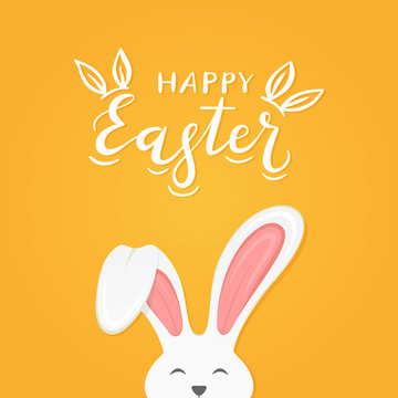 Orange background with text Happy Easter and rabbit ears