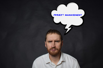 Above the businessman hangs a cloud with the inscription:PROJECT MANAGEMENT