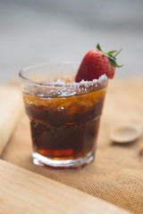 Soft drink with salt and fresh strawberries