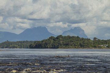 View of 'Rio Negro' river with 'Curi Curiari' sierra in the background, also called 'Sleeping beauty'. .São Gabriel da Cachoeira, Amazon / Brazil