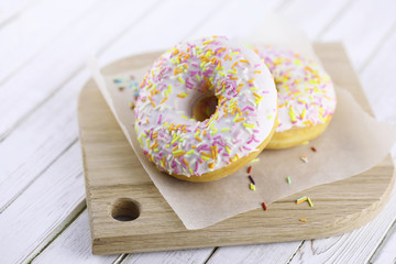 Donut on a wooden white background