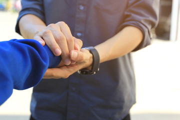 Man and woman holding hands of romantic couple in love, Take care