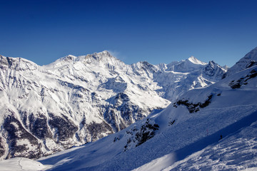 Fototapeta na wymiar Zinal Alps panorama from Sorbois mountain station in Switzerland. The village is a typical Swiss ski resort linked with Grimentz to form a great skiing area