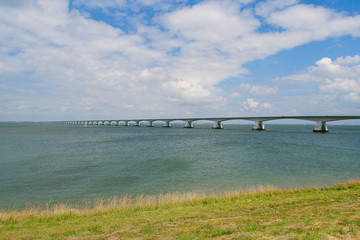 Zeeland bridge near Walheren Netherlands - white modern bridge over blue water