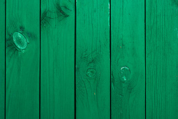 Obraz premium Green wooden board with knots - wooden background