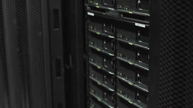 Server engineer opens rack server cabinet