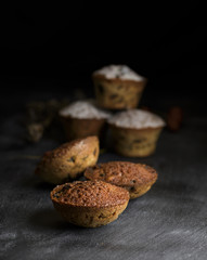 baked cupcakes on a black wooden table
