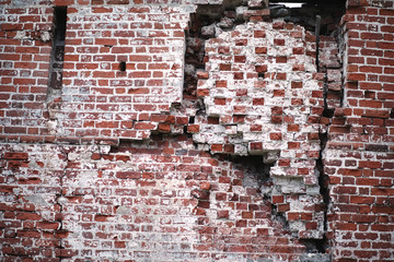 Old brick wall with a crack