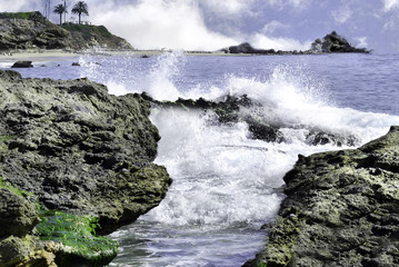 Splashing and rushing water against the rocks