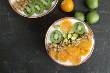 Natural healthy yogurt with muesli and fruit.