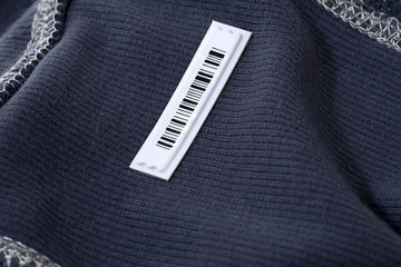 Security tag on cloth to prevent shoplifting. 