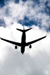 Skyward view of landing plane