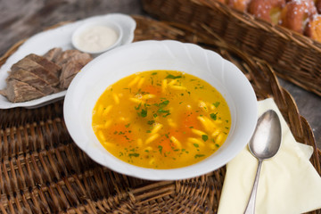 chicken soup with noodles and parsley