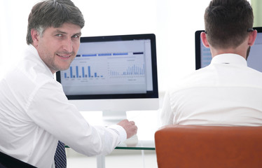 Fototapeta premium Economists of the company compile financial charts