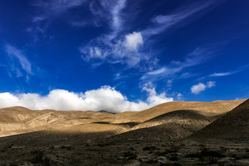 Blue sky and clouds over the mountains