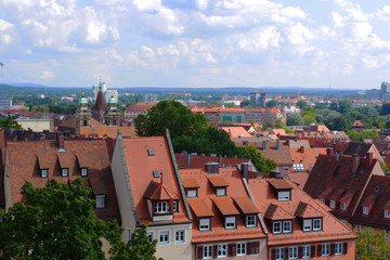 Obraz premium Multicolored houses with multi-colored roofs. View of the city.