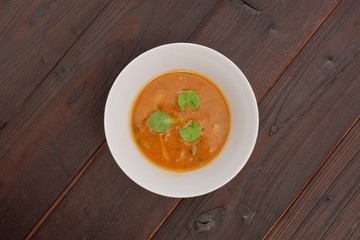 Oyster mushroom soup with vegetables on table