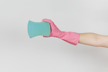 Close up of female hand in pink gloves horizontal holds blue large sponge for cleaning and washing dishes isolated on white background. Cleaning supplies concept. Copy space for advertisement