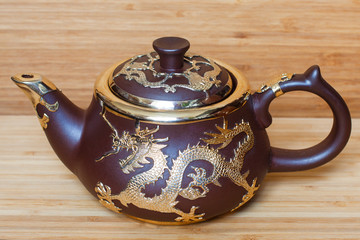 Chinese clay teapot with dragon gold plated