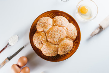 Fresh baked bread on plate and ingredients.