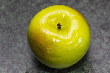 Green apple on a dark background