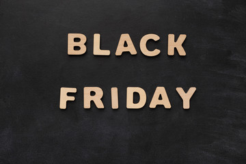 Obraz premium Black Friday spelled with wooden letters
