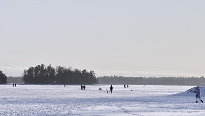 People walking on the frozen sea, Espoo, Finland