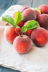 ripe peaches on a wooden background.