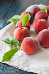 ripe peaches on a wooden background.