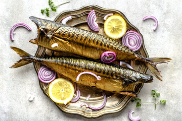 Delicious mackerel. Smoked fish dish on table, food with omega 3 fat, healthy eating concept