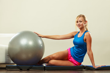 woman doing fitness exercises with fit ball