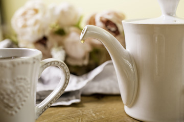 drop of tea coffee from a tea pot 