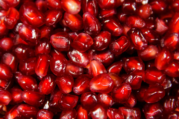 Food background of the fresh ripe pomegranate seeds