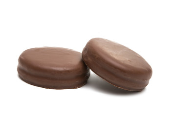 Obraz na płótnie Canvas chocolate biscuit sandwich in chocolate glaze isolated