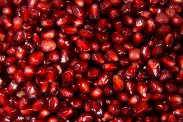 Food background of the fresh ripe pomegranate seeds