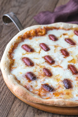 Pizza with mozzarella and salami